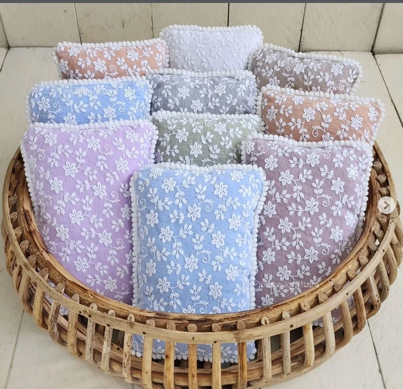 Neutral throw pillow with vintage lace panels, soft textured fabric, ideal vintage lace handmade items for farmhouse and romantic interiors.