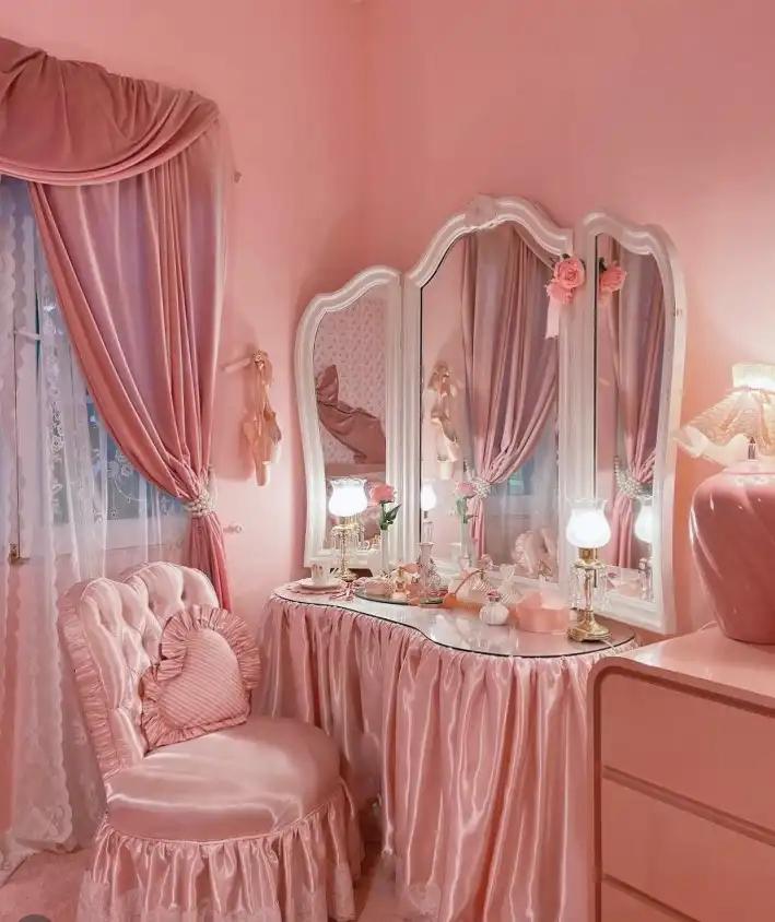 Vintage feminine bedroom ideas with pink satin bedding, ballet-inspired decor, and velvet curtains