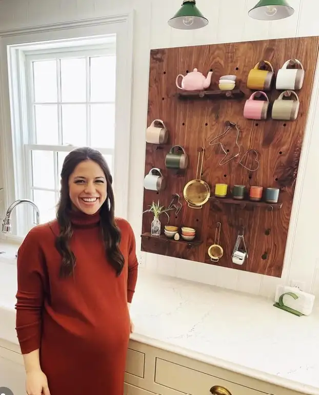 kitchen pegboard wall with hanging utensils organized and space saving wall storage idea