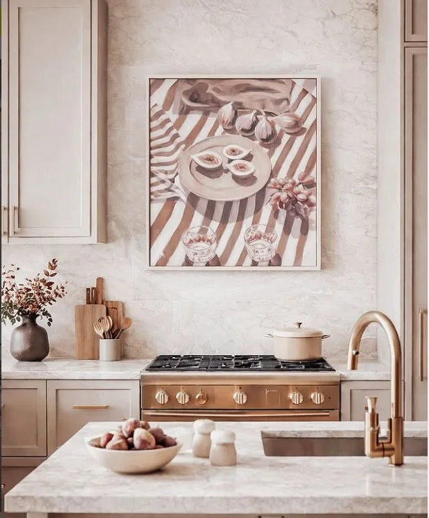 large statement artwork on blank kitchen wall creating a bold modern kitchen focal point