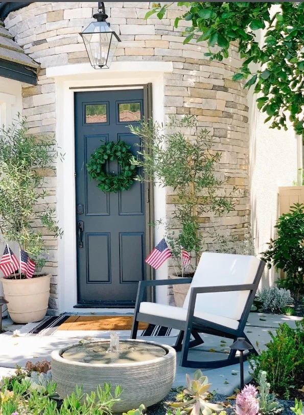 tiny front porch with bold front door color