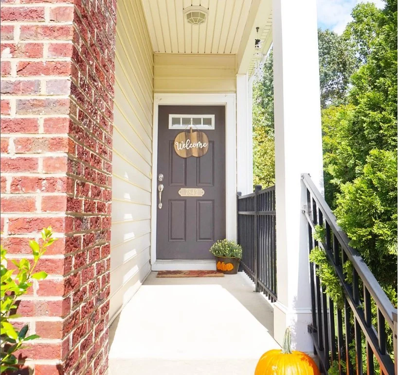townhouse front porch with bold painted front door