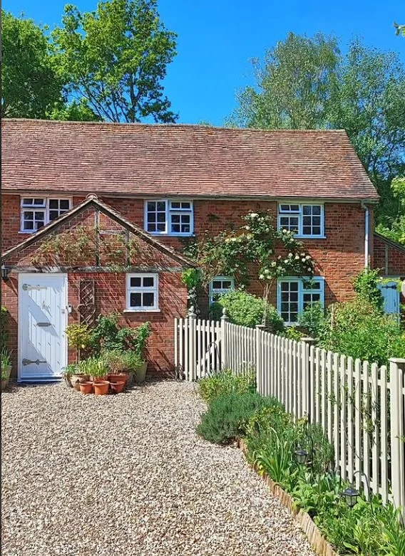 cottage front porch with clay pots and plant decor