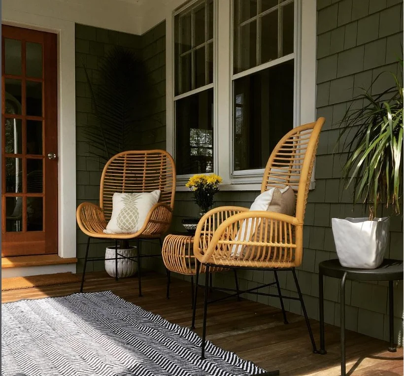 small side porch with narrow outdoor rug and decor