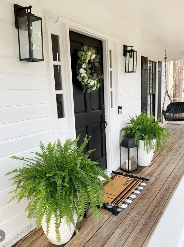 tiny front porch with narrow outdoor rug and decor