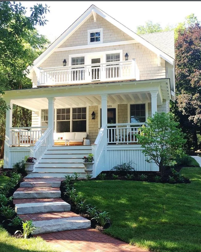 cottage front porch with natural wood details and trim