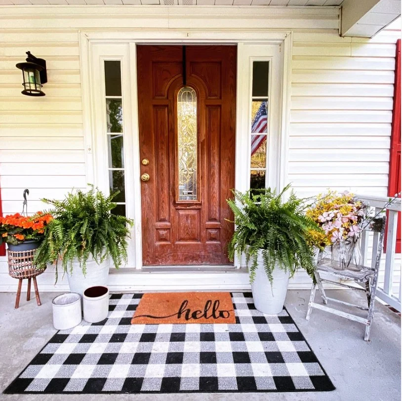front stoop makeover with outdoor rug styling