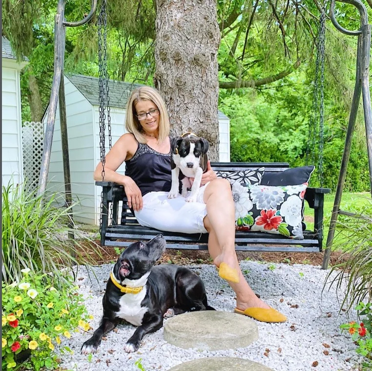 cottage front porch with porch swing and cozy cushions