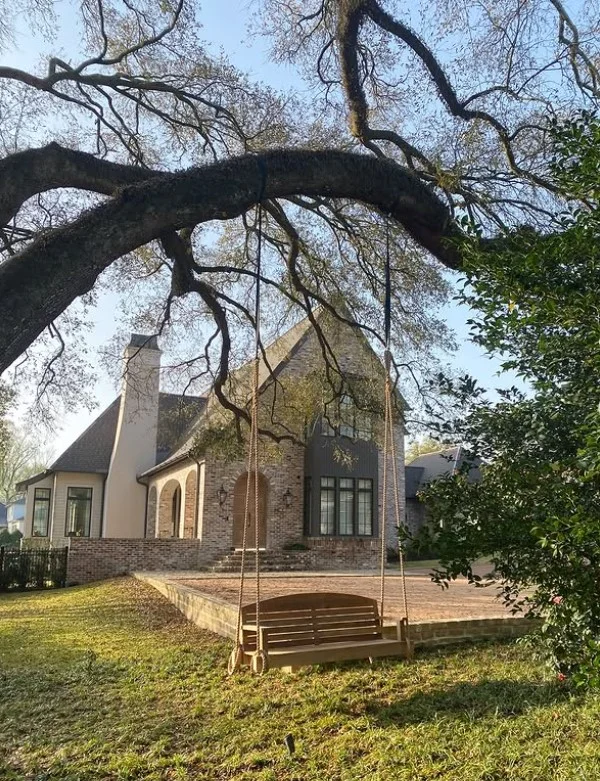 bungalow front porch with hanging porch swing seating idea