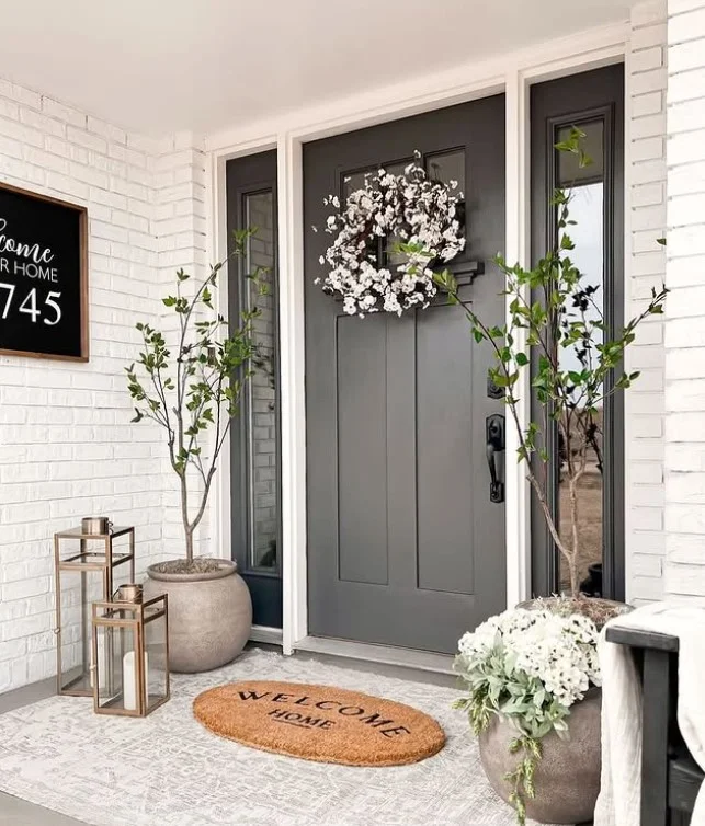 tiny front porch with welcome mat entry design
