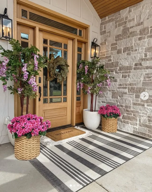 townhouse front porch with stylish welcome mat at entry