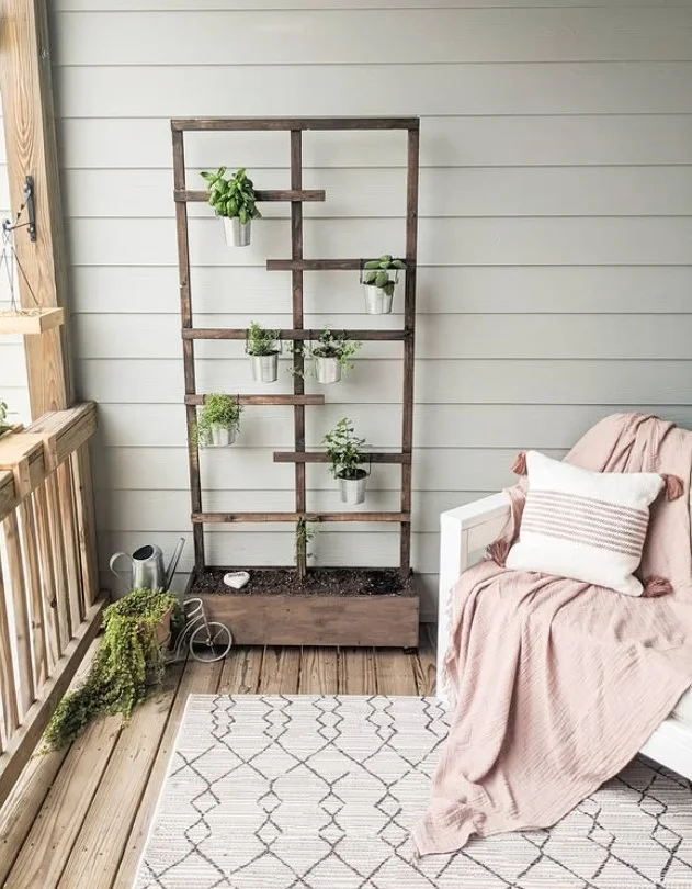 small side porch with vertical plant stand space saving idea