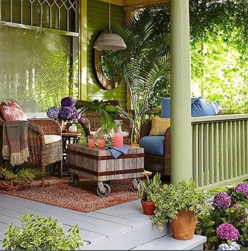 cottage front porch with wicker furniture and cozy setup