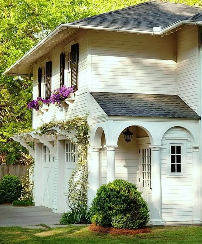 bungalow front porch with colorful window boxes and flowers