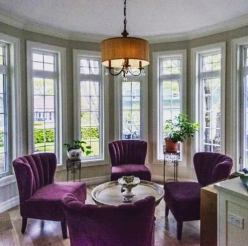 four season room with floor to ceiling windows natural light