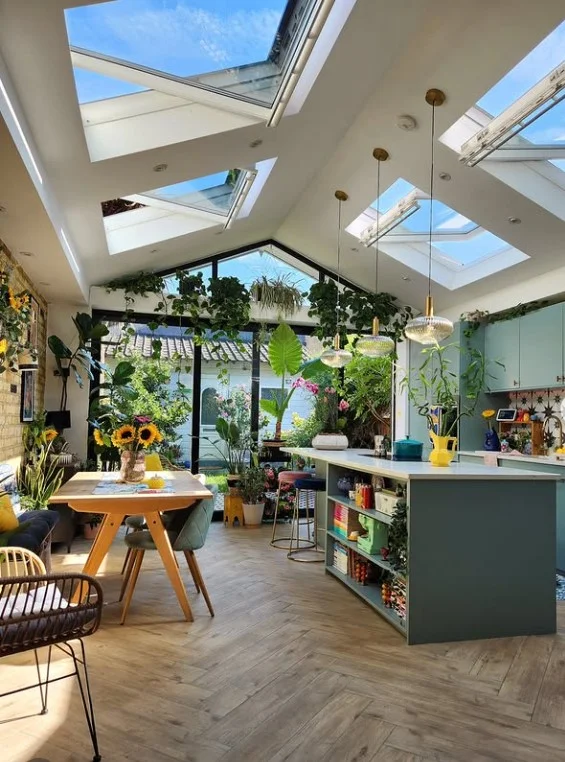 greenery decorating four season room off kitchen