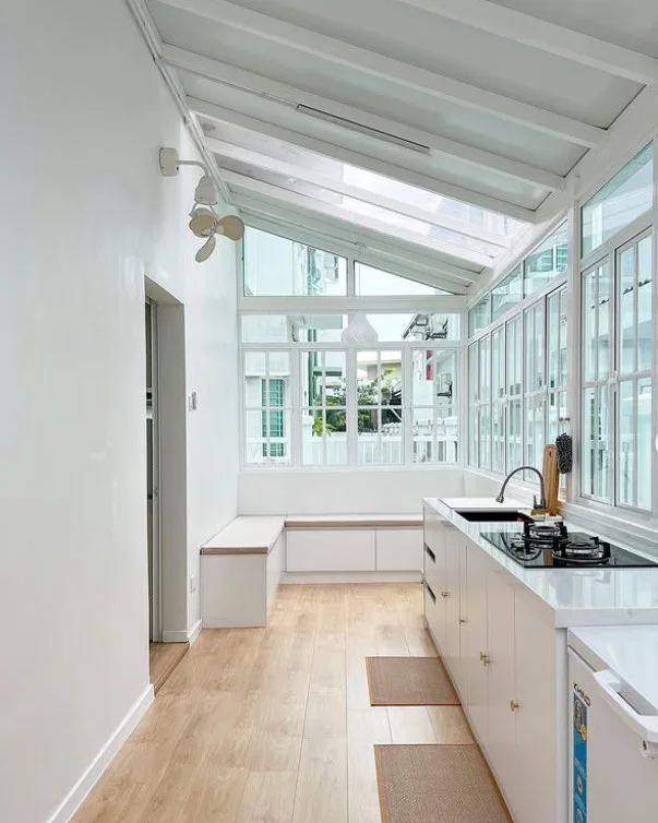 minimal decor in bright four season room space