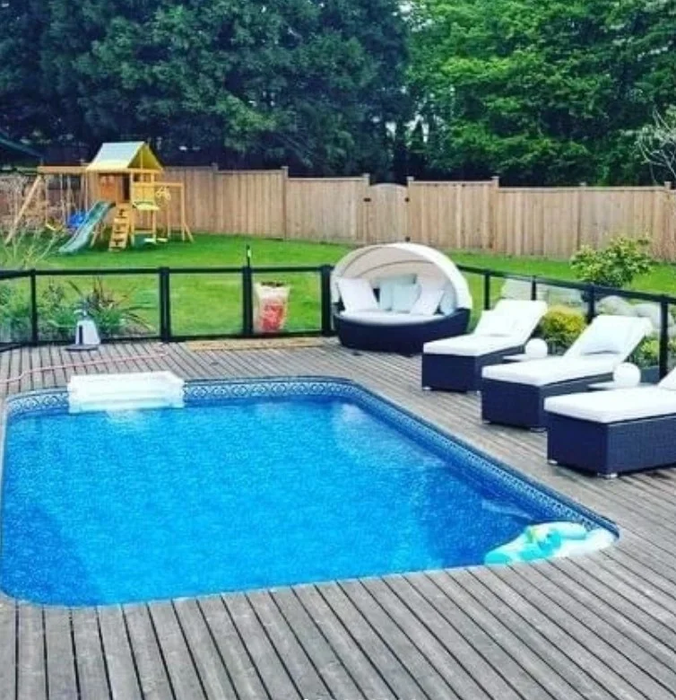 black railings on modern above ground pool deck