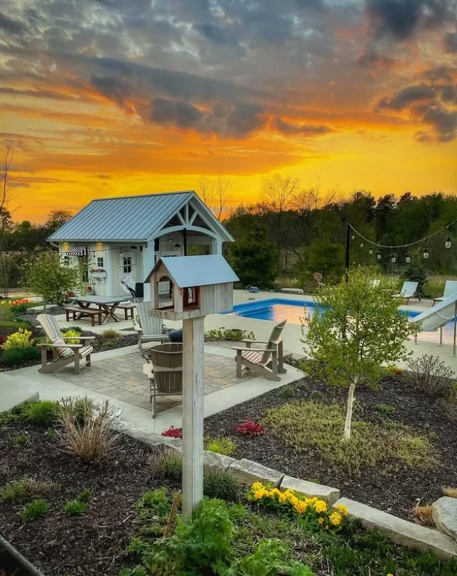 cozy outdoor seating beside above ground pool deck