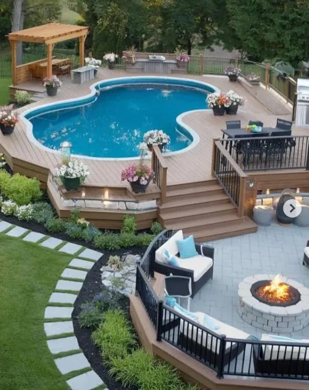 fire pit beside above ground pool deck area