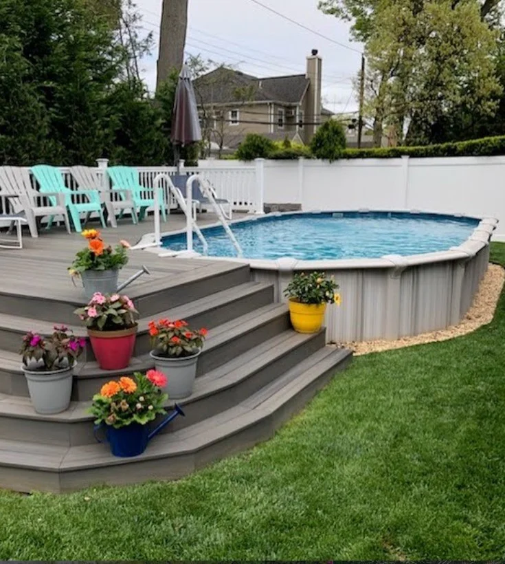 modern deck stairs leading to above ground pool