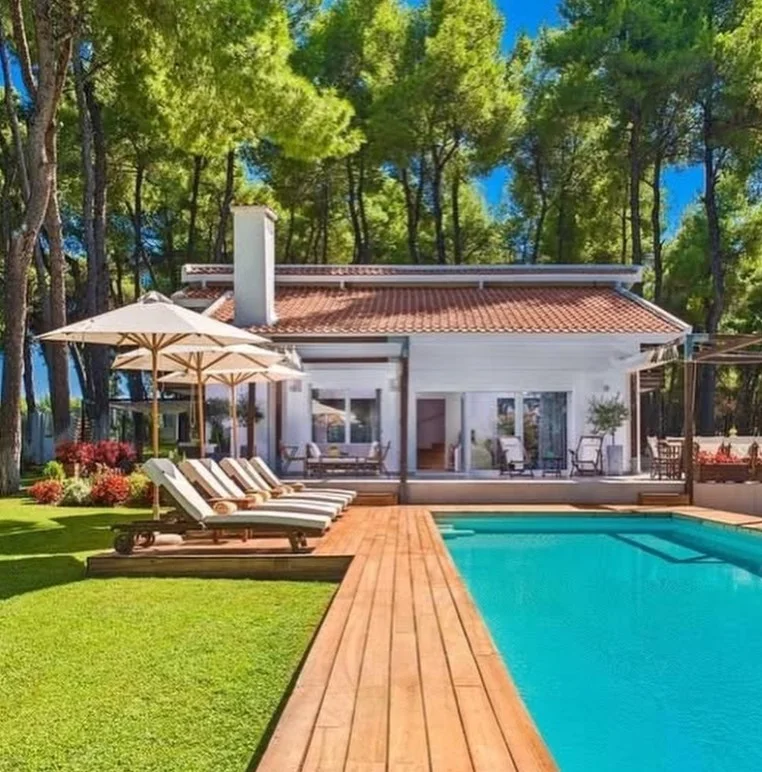 cozy outdoor furniture on poolside deck area