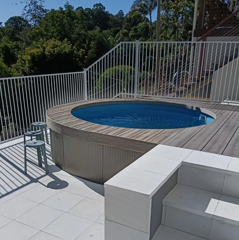 wraparound deck around above ground pool backyard