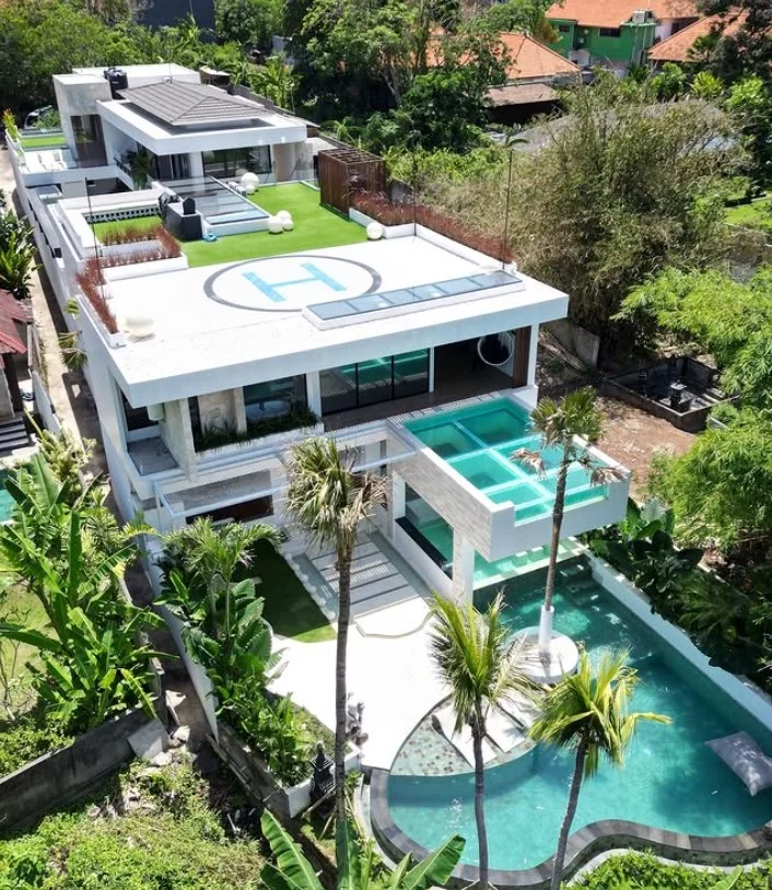 greenery surrounding sunken above ground pool backyard
