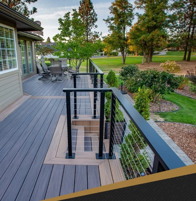 black cable railing posts on modern wood backyard deck
