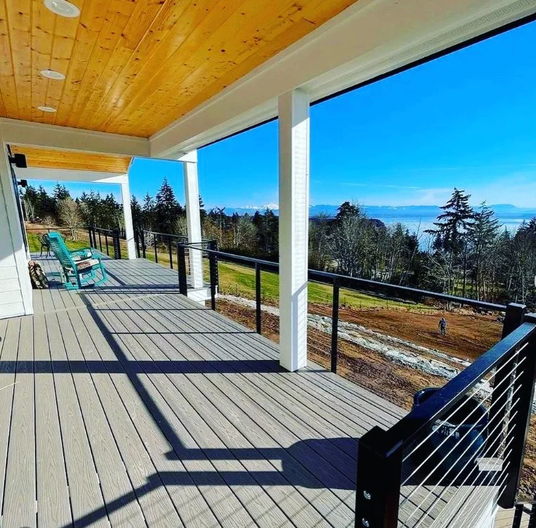 modern farmhouse deck with black cable railing and wood posts