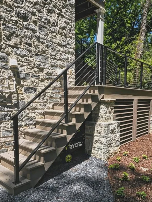 outdoor stairs with black cable railing modern deck style