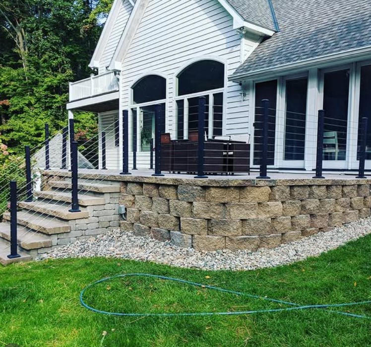 open backyard deck design with sleek cable railings