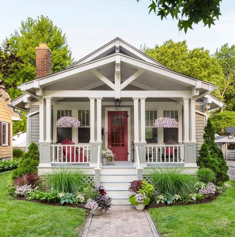 covered porch front entrance with cozy seating