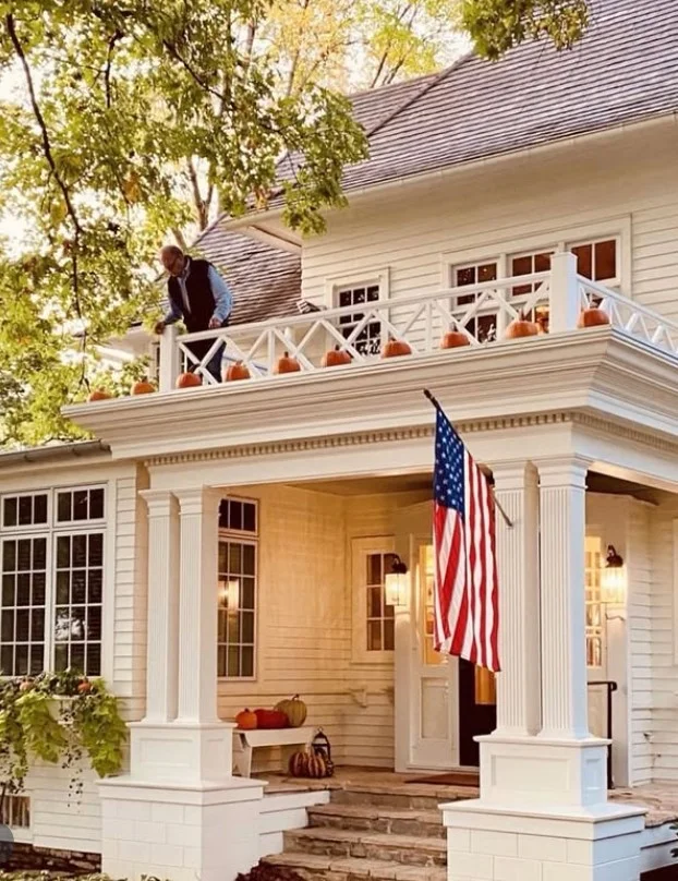 cozy front porch entrance with warm outdoor lighting