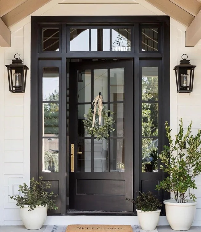 front porch entrance with welcome mat and layered rug