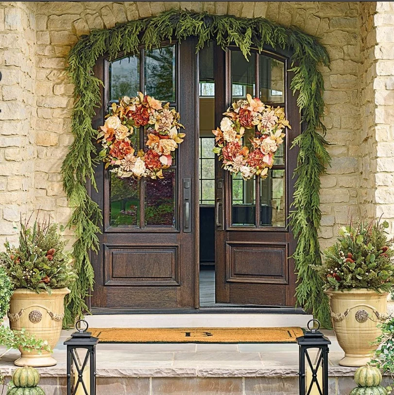 greenery framing front door outside entrance beautifully