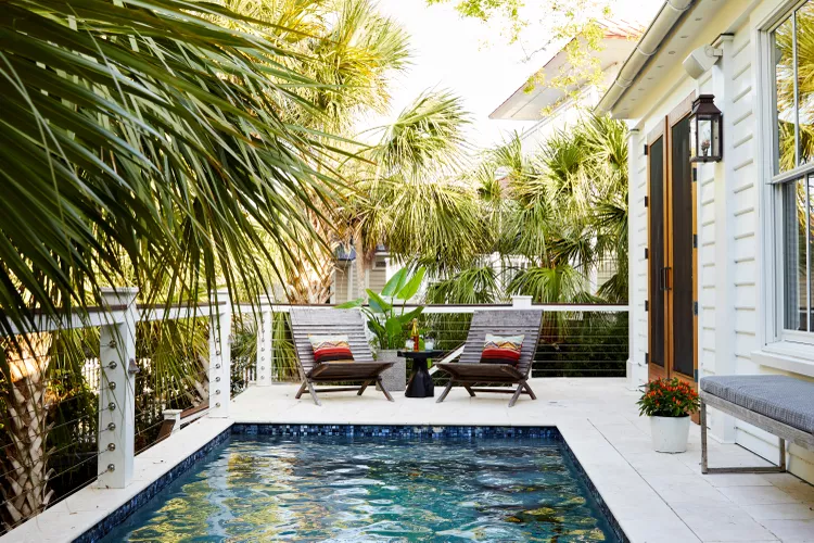 horizontal railing around luxury backyard pool deck