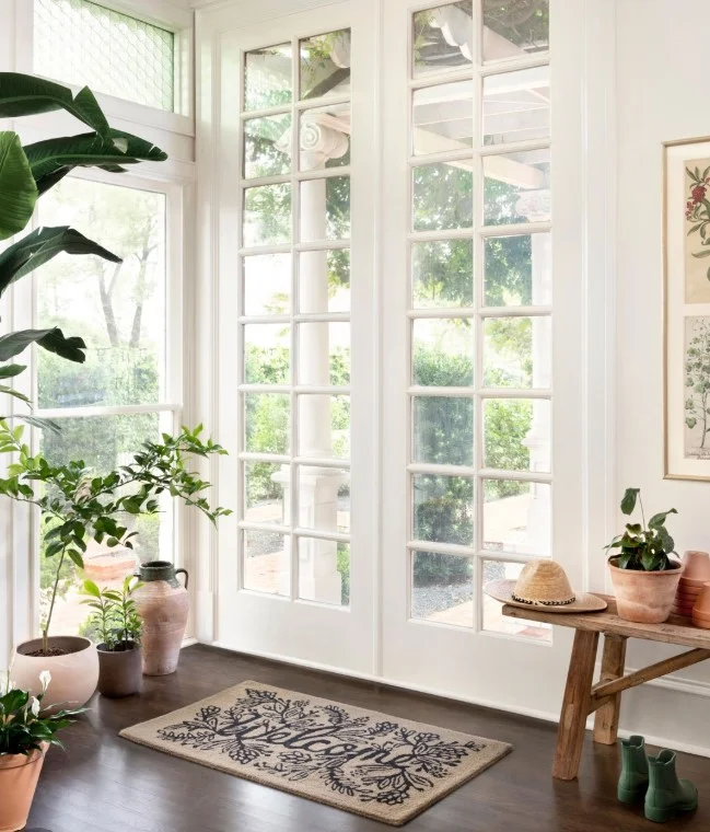 inside porch entrance with simple welcome rug clean decor