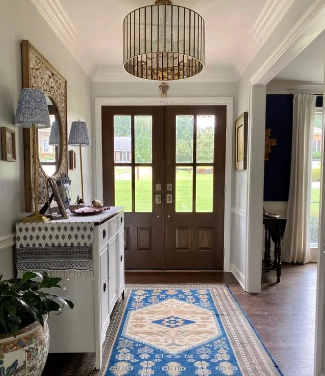 inside porch with wall mirror making space look bigger