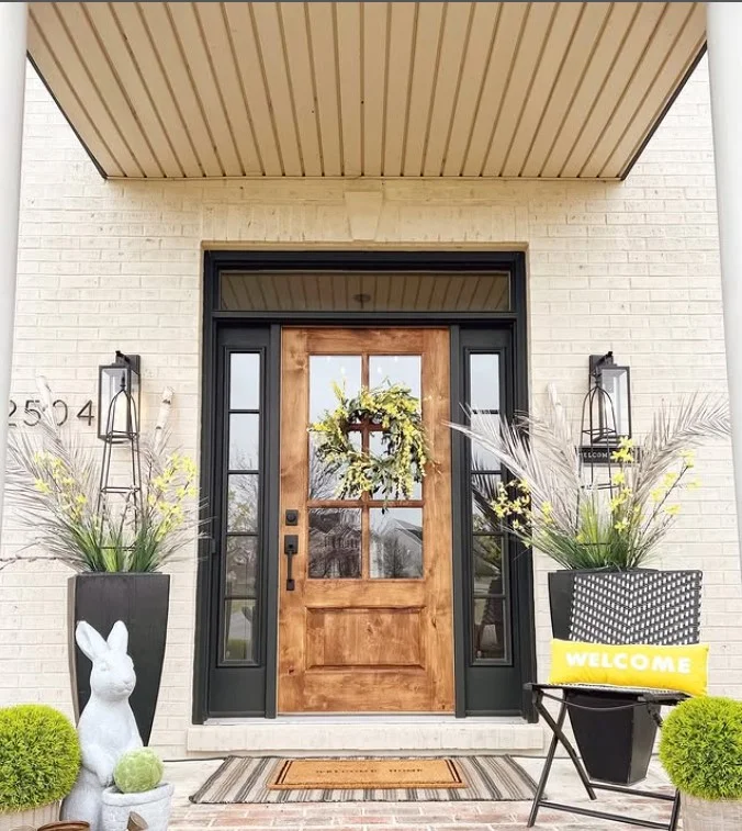 layered doormats on small front stoop stylish entry idea