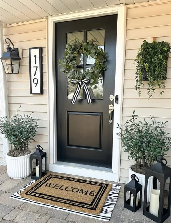 layered welcome mats outside modern front entrance