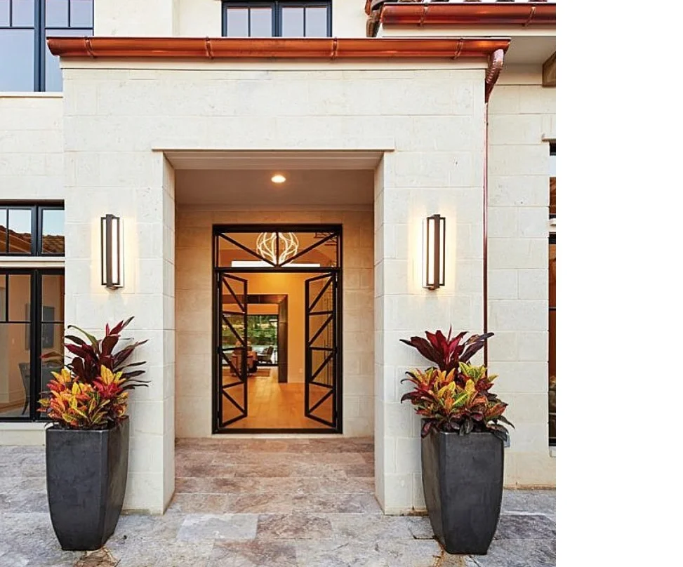 modern wall sconces lighting front entrance at night