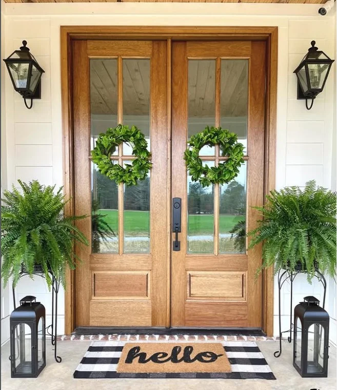 layered outdoor rugs on modern front porch