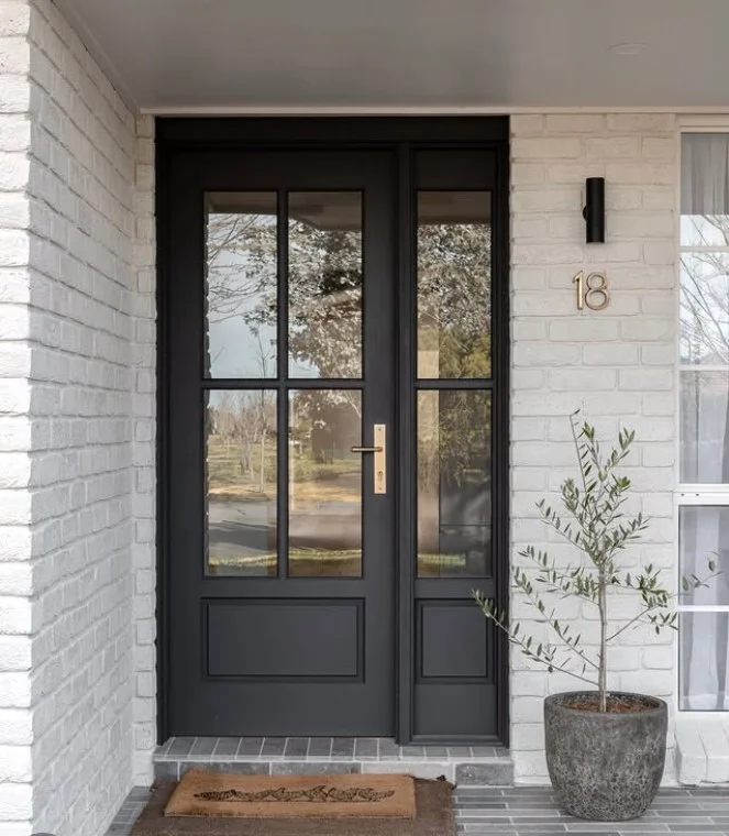 oversized planters decorating modern porch entrance