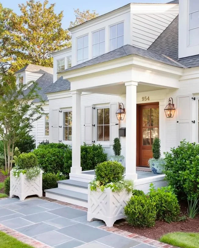 modern wall lighting beside stylish front porch entrance