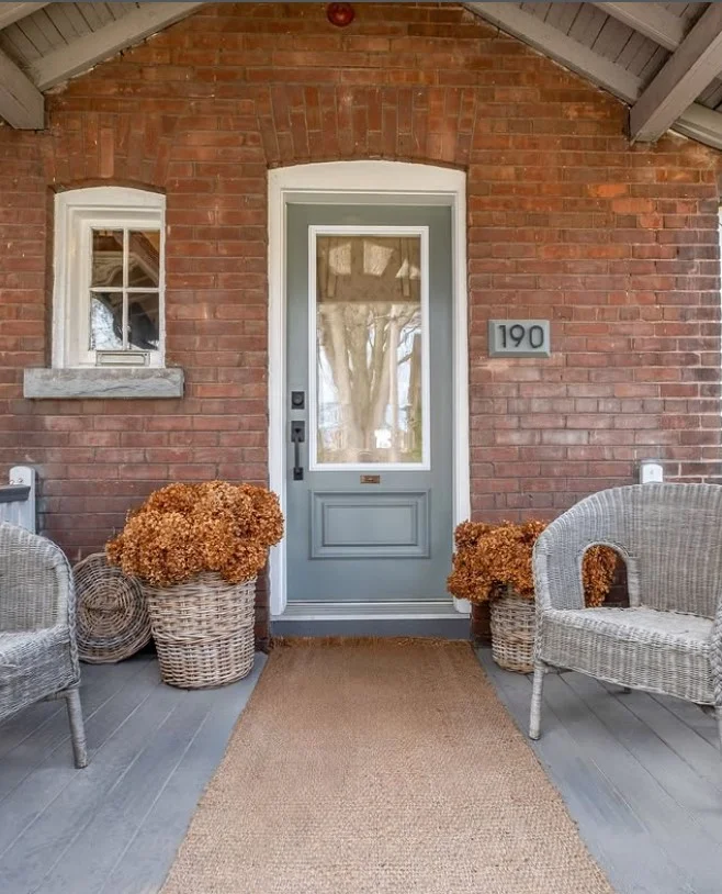 small front stoop with wood and natural materials decor
