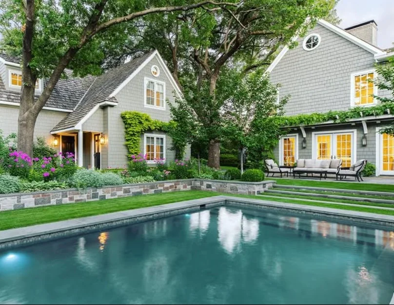 natural stone landscaping around sunken above ground pool