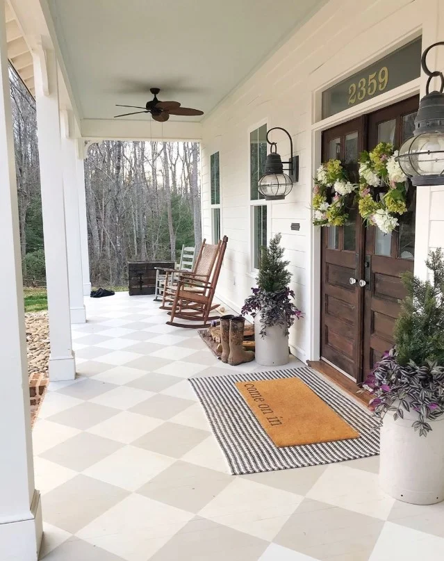 open front porch with stylish doormat clean entry