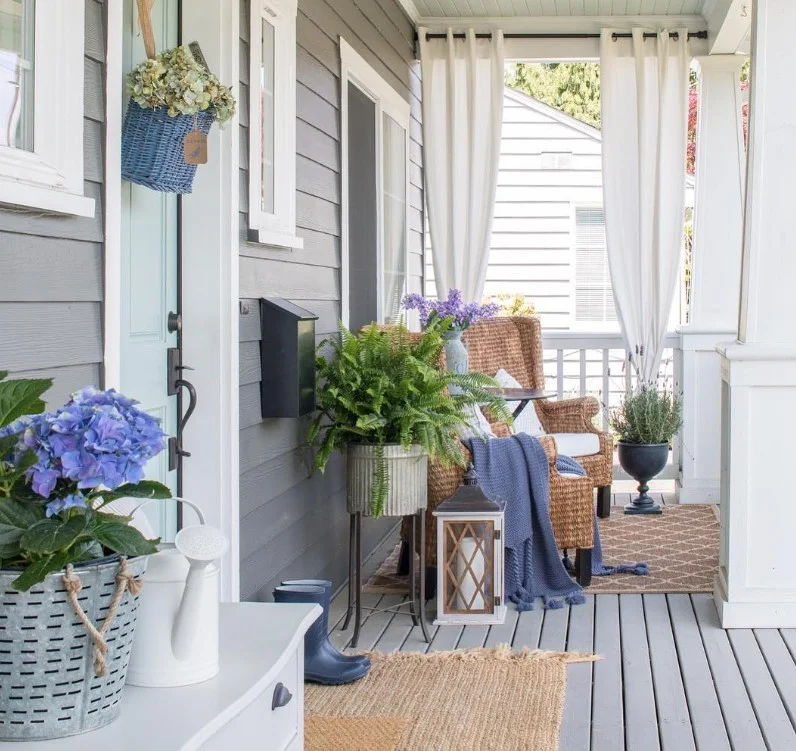 open front porch with outdoor curtains soft airy look