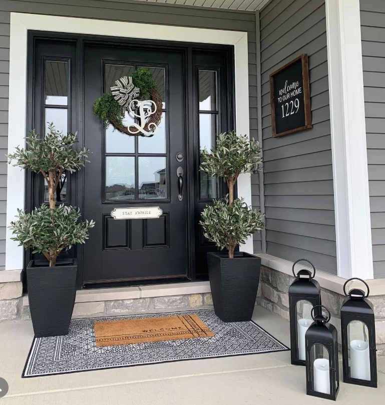 open front porch with painted front door bold color